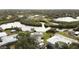 Aerial view showcasing home's canal-front location and neighborhood at 446 Court St, Englewood, FL 34223