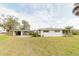 House exterior showcasing carport and well-maintained lawn at 446 Court St, Englewood, FL 34223