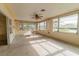 Bright sunroom with water views, ready for your personal touch at 446 Court St, Englewood, FL 34223