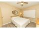 Bedroom with ceiling fan and neutral colored walls at 6113 Partridge Ave, Englewood, FL 34224