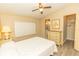 Bedroom with ceiling fan, neutral colored walls and closet at 6113 Partridge Ave, Englewood, FL 34224