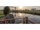 Picturesque canal view at sunset, reflecting the sky, with lush landscaping at 6113 Partridge Ave, Englewood, FL 34224