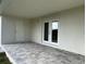 Covered patio with pavers, double doors and storage at 9992 Antler St, Port Charlotte, FL 33981