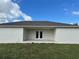 Covered patio with paver surface and double French doors at 9992 Antler St, Port Charlotte, FL 33981