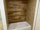 Clean bathroom featuring a shower/tub combo and wood-look tile at 9992 Antler St, Port Charlotte, FL 33981