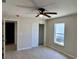 Bedroom with ceiling fan, window, and sliding closet doors at 9992 Antler St, Port Charlotte, FL 33981