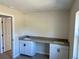 Bright laundry room with double sink and modern cabinets at 9992 Antler St, Port Charlotte, FL 33981