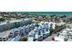 Aerial view of a neighborhood of white condos along the beach with turquoise ocean water at 2255 N Beach Rd # 9, Englewood, FL 34223