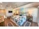 Bright bedroom features a king bed, ceiling fan, and access to the ensuite bathroom at 2255 N Beach Rd # 9, Englewood, FL 34223