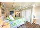 A bedroom with a queen bed, TV, white trim, and two large closets at 2255 N Beach Rd # 9, Englewood, FL 34223
