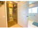 Open walk-in closet and bathroom with a window and shower at 2255 N Beach Rd # 9, Englewood, FL 34223