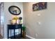 Nicely decorated hallway corner featuring a small black table, a decorative lamp, and an oval mirror at 2255 N Beach Rd # 9, Englewood, FL 34223