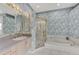 Bathroom boasts a large bathtub, separate shower, and updated vanity at 3238 Osprey Ln, Port Charlotte, FL 33953