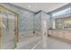 Bathroom with shower, bathtub, double vanity, and patterned wallpaper at 3238 Osprey Ln, Port Charlotte, FL 33953