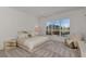 Bright bedroom with a large window, plush bedding, and a relaxing seating area at 3238 Osprey Ln, Port Charlotte, FL 33953