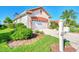 Side view of house showing garage and mailbox at 3238 Osprey Ln, Port Charlotte, FL 33953