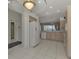 Kitchen with white appliances, light wood cabinets, and a view to the backyard at 3238 Osprey Ln, Port Charlotte, FL 33953