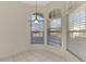 Kitchen nook with large windows, light tile floors, and a view to the backyard at 3238 Osprey Ln, Port Charlotte, FL 33953