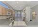 Kitchen features white appliances, light wood cabinets, and a breakfast nook at 3238 Osprey Ln, Port Charlotte, FL 33953
