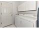 Bright laundry room with washer and dryer at 3238 Osprey Ln, Port Charlotte, FL 33953