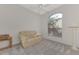 Bright office space with a comfortable couch and large window at 3238 Osprey Ln, Port Charlotte, FL 33953