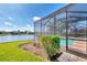 Relaxing screened pool and patio overlooking a lake at 3238 Osprey Ln, Port Charlotte, FL 33953