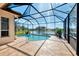 Inviting pool with screened enclosure at 3238 Osprey Ln, Port Charlotte, FL 33953