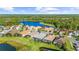 Community overview showcasing lakefront homes and lush landscaping at 11564 Renaissance Blvd, Venice, FL 34293