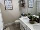 Bright bathroom with dual sinks and updated fixtures at 16383 S Port Harbor Blvd, Port Charlotte, FL 33953