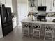 Modern kitchen with black appliances and white cabinets at 16383 S Port Harbor Blvd, Port Charlotte, FL 33953