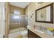 Clean bathroom with a shower/tub combo and granite vanity at 2 Marker Rd, Rotonda West, FL 33947