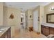 Elegant bathroom with double vanity and granite countertop at 2 Marker Rd, Rotonda West, FL 33947