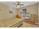 Cozy bedroom with striped bedding and wood-toned furniture at 2 Marker Rd, Rotonda West, FL 33947