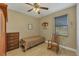 Small bedroom with a twin bed, dresser, and rocking chair at 2 Marker Rd, Rotonda West, FL 33947