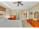 Main bedroom with ceiling fan and ample closet space at 2 Marker Rd, Rotonda West, FL 33947