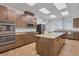 Modern kitchen with granite island and stainless steel appliances at 2 Marker Rd, Rotonda West, FL 33947