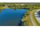 Peaceful lakefront property with walking path nearby at 2 Marker Rd, Rotonda West, FL 33947