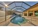 Inviting screened pool and patio area, perfect for relaxation at 2 Marker Rd, Rotonda West, FL 33947