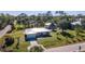 Aerial view of a single-story house with a metal roof and large backyard at 445 Stewart St, Englewood, FL 34223