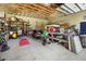 Well-lit garage with lots of storage and workbenches at 445 Stewart St, Englewood, FL 34223