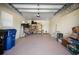 Garage with shelving, storage, and a large door at 445 Stewart St, Englewood, FL 34223