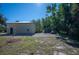 Large backyard with detached building and gravel area at 445 Stewart St, Englewood, FL 34223