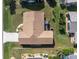 Aerial view of single-Gathering home's roof and yard at 5826 Harrison Rd, Venice, FL 34293