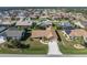 Aerial view of single-Gathering home with driveway and yard at 5826 Harrison Rd, Venice, FL 34293