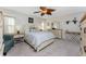 Bedroom with queen bed, dresser, and plenty of natural light at 5826 Harrison Rd, Venice, FL 34293