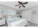 Bright bedroom with a queen bed, window coverings, and ample closet space at 5826 Harrison Rd, Venice, FL 34293