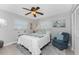 Cozy bedroom with a comfortable queen-size bed and plenty of natural light at 5826 Harrison Rd, Venice, FL 34293