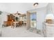 Bright dining room featuring a table, chairs, and built-in hutch at 5826 Harrison Rd, Venice, FL 34293