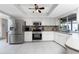 Updated kitchen, stainless steel appliances, and white cabinets at 5826 Harrison Rd, Venice, FL 34293