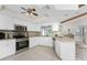 Modern kitchen with stainless steel appliances and an island at 5826 Harrison Rd, Venice, FL 34293